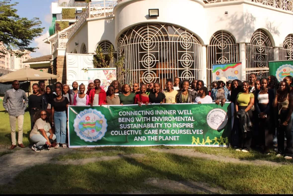 Large group of BWGN youth holding the campaign banner outdoors